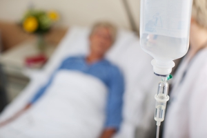 patient in bed recieving intravenous therapy